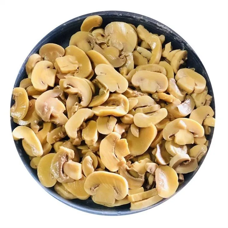 Sliced white mushroom in plastic drums